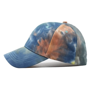 Distressed tie-dye baseball cap featuring blue and orange patterns with curved brim