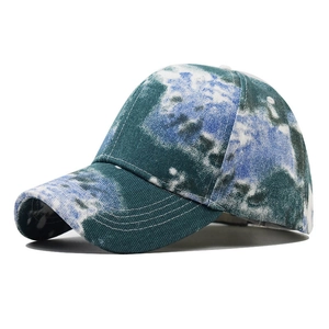 Detail view of the blue and white tie-dye pattern on this vintage-style cotton baseball cap
