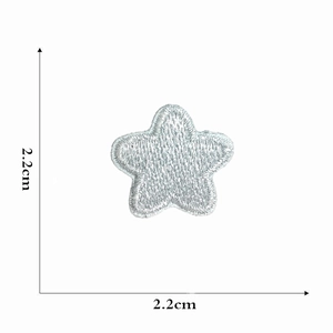 Detail view of 2.2cm silver star embroidery patch showing texture and dimensions
