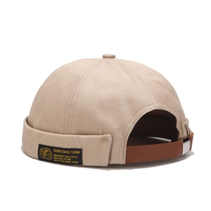 Classic beige cotton miki hat with adjustable brown leather strap and side fabric label