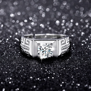 Detailed view of men's silver ring with Greek key pattern and brilliant zircon stone