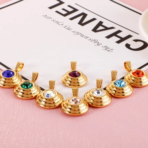 Eight gold-tone round pendants with colorful cubic zirconia stones in circular arrangement