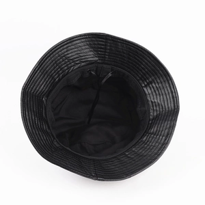Detail of black PU leather bucket hat featuring internal adjustable drawstring and stitching