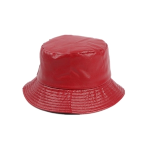 Detailed view of red PU leather bucket hat showing textured material and parallel stitching