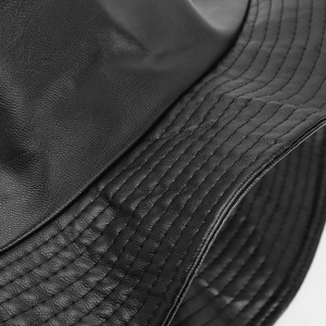 Macro shot of high-quality black PU leather bucket hat with reinforced stitching details
