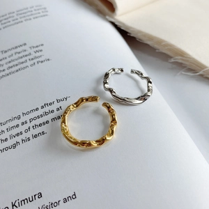 Minimalist irregular wavy open ring in gold and silver finish with hammer texture