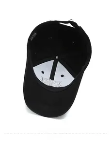 Detailed inner view of black cotton baseball cap showing lining and care label
