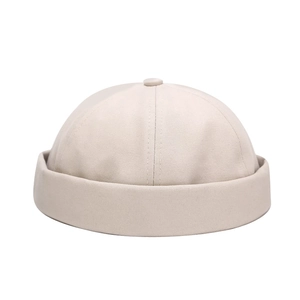 Minimalist beige cotton miki hat with retro brimless design and twill texture