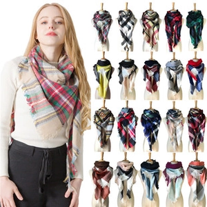 Detail view of various plaid patterns and color options for a soft knit winter triangle scarf