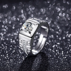 Macro detail of silver ring with round zircon center and geometric hollow pattern