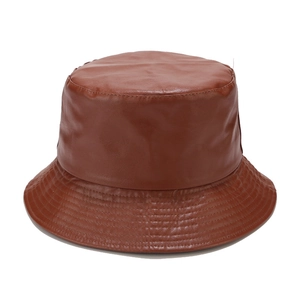 Detailed view of the brown PU leather bucket hat texture and reinforced stitching