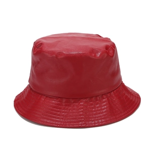 Detail view of red PU leather bucket hat showing high-quality stitching and smooth texture