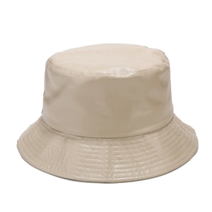 Detailed close-up showing the premium PU leather texture and stitching of this beige bucket hat