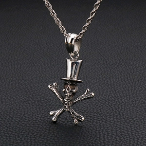 Punk style stainless steel skull with top hat and crossbones pendant on a twisted chain