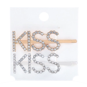 Detail of gold and silver hair clips featuring rhinestone KISS lettering on a display card