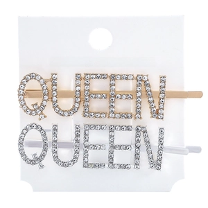 Detail of gold and silver QUEEN letter hair clips with sparkling rhinestone inlay