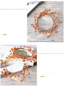 Detail of realistic orange berries and brown rustic branches for festive table decoration