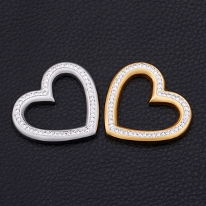 Hollow heart pendants in gold and silver finish with rhinestones on black leather