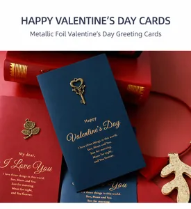 Detailed close-up of vintage metal rose ornament and gold foil text on dark red card