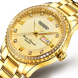 Detail of gold quartz watch featuring dual calendar display and diamond hour markers