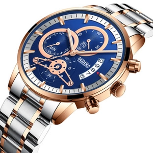 Detail of silver and rose gold watch band with a deep blue dial and date window