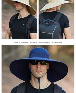 Detail of wide brim sun hats in beige and navy featuring breathable mesh and windproof cords
