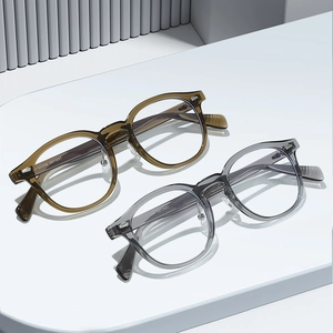 Retro TR90 round glasses frames in translucent brown and grey with silver rivet details