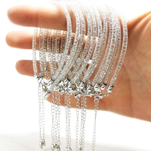 Detailed view of silver mesh woven bracelets with adjustable lobster clasp and chain