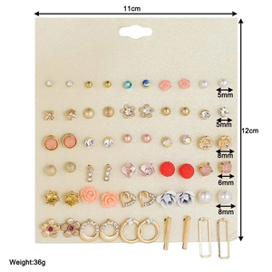 Detail view of 30 pairs assorted stud earrings on 11cm x 12cm beige card display set