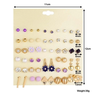 Detailed view of 30 pairs alloy floral stud earrings set with sizes on beige card
