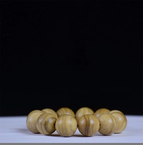 Macro view showing natural grain and oil lines of the Agarwood 108 prayer beads bracelet