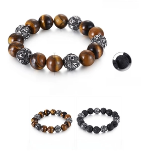 Detail view of 12mm tiger eye and lava stone beads with engraved stainless steel accents