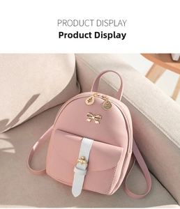 Detailed view of pink PU leather mini backpack with bow knot and leaf zipper puller