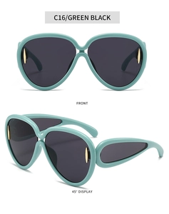 Détails de lunettes de soleil oversize vert menthe avec verres foncés et accents dorés