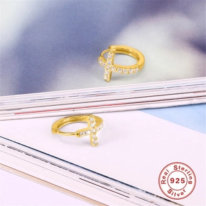 Close-up of gold S925 sterling silver hoop earrings with cubic zirconia cross charms