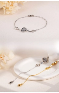 Detail of heart bracelet lobster clasp and extension chain in gold and silver