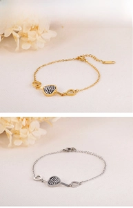 Detail of stainless steel heart bracelets with crystal pave charms in gold and silver