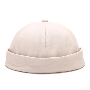 Classic beige cotton docker cap with a six-panel stitch design and rolled brim