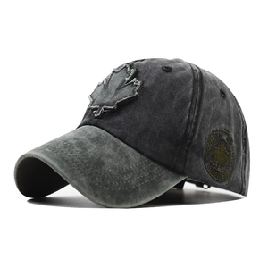 Detail of vintage washed cotton baseball cap with maple leaf patch and side embroidery