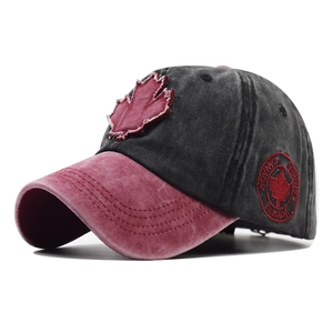 Close-up of vintage washed cotton baseball cap with red maple leaf and Canada embroidery