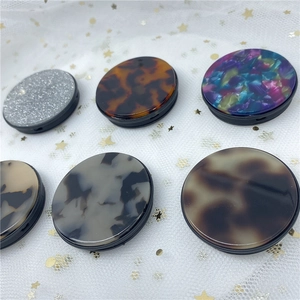 Various stylish tortoiseshell and marble patterns on expandable phone socket stands