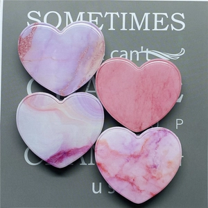 Set of four heart-shaped folding phone grips with pink and purple marble pattern