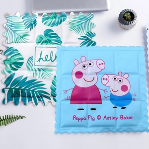 Close-up of PVC gel cooling pads with wave edges and cartoon character prints
