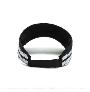 Rear view of black sun visor with adjustable velcro strap and reflective safety strips