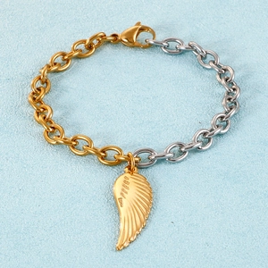 Two-tone stainless steel link bracelet featuring a golden feather wing charm and lobster clasp