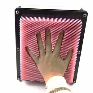 Pink 3D pin art toy showing a detailed hand impression in a black square plastic frame