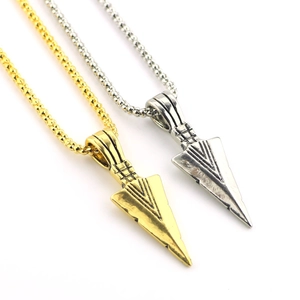 Vintage gold and silver arrow pendant necklaces for men with textured metal details