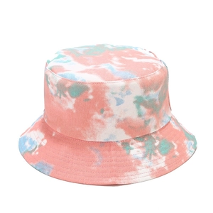 Detail of pink and blue tie-dye bucket hat showing cotton texture and vibrant patterns