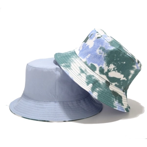 Detail of solid color and tie-dye reversible bucket hats with premium stitching detail