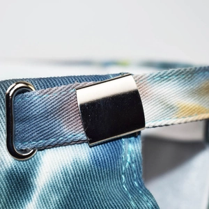 Adjustable metal buckle and tie-dye cotton strap on a vintage washed baseball cap
